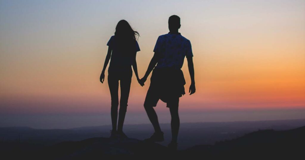 odds of finding your soulmate - couple silhouette at sunset